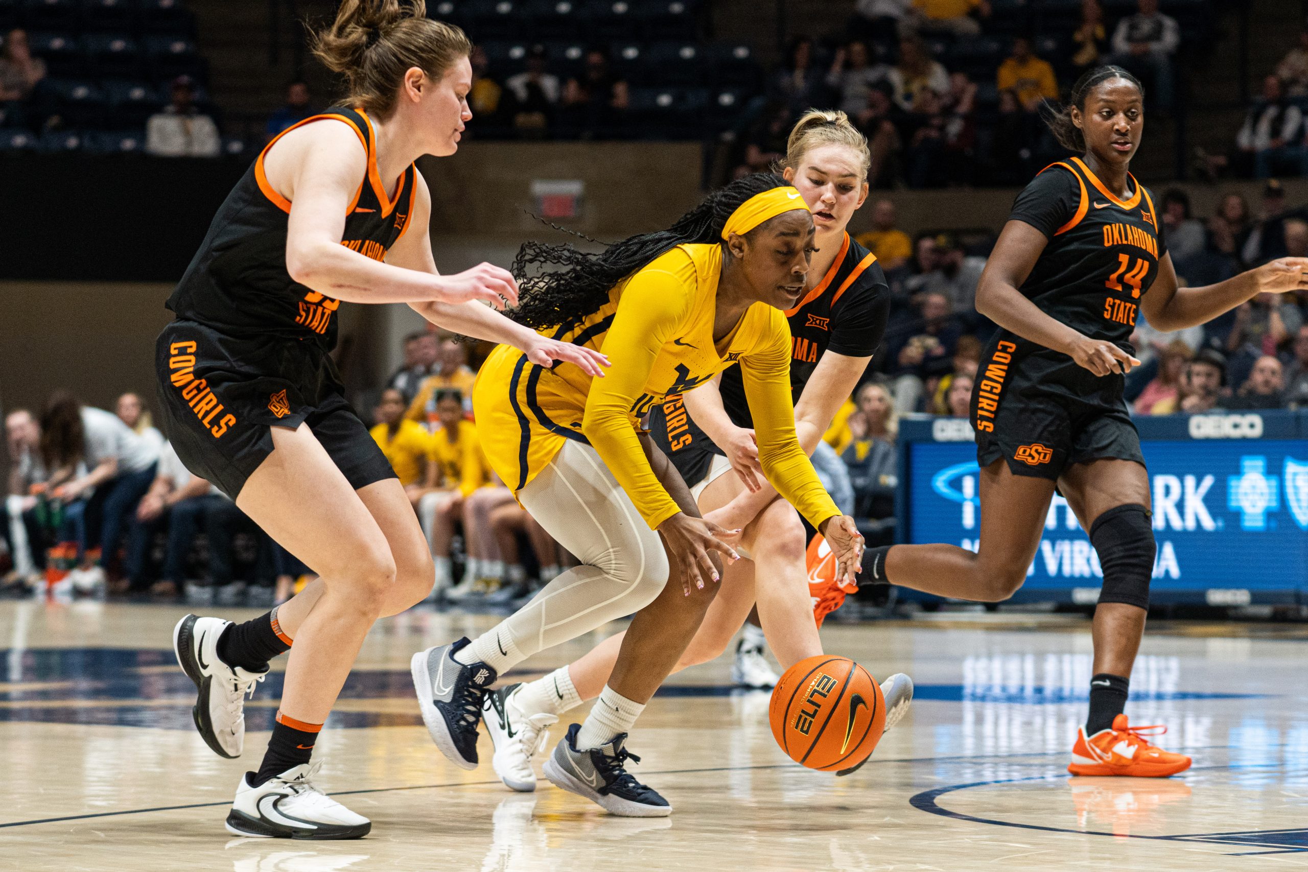 WVU holds off Oklahoma State to stay alive in NCAA-tournament discussion